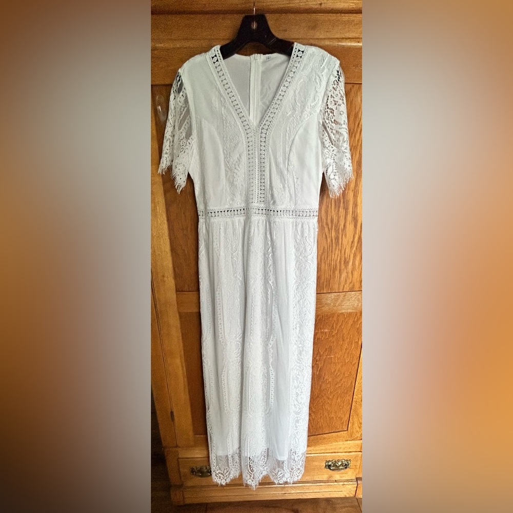 Maxi dress New Lace over lining. White. Says large fits like a small. Never worn